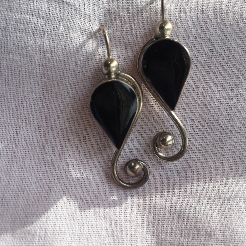Beautiful hand made black earrings. Signed
